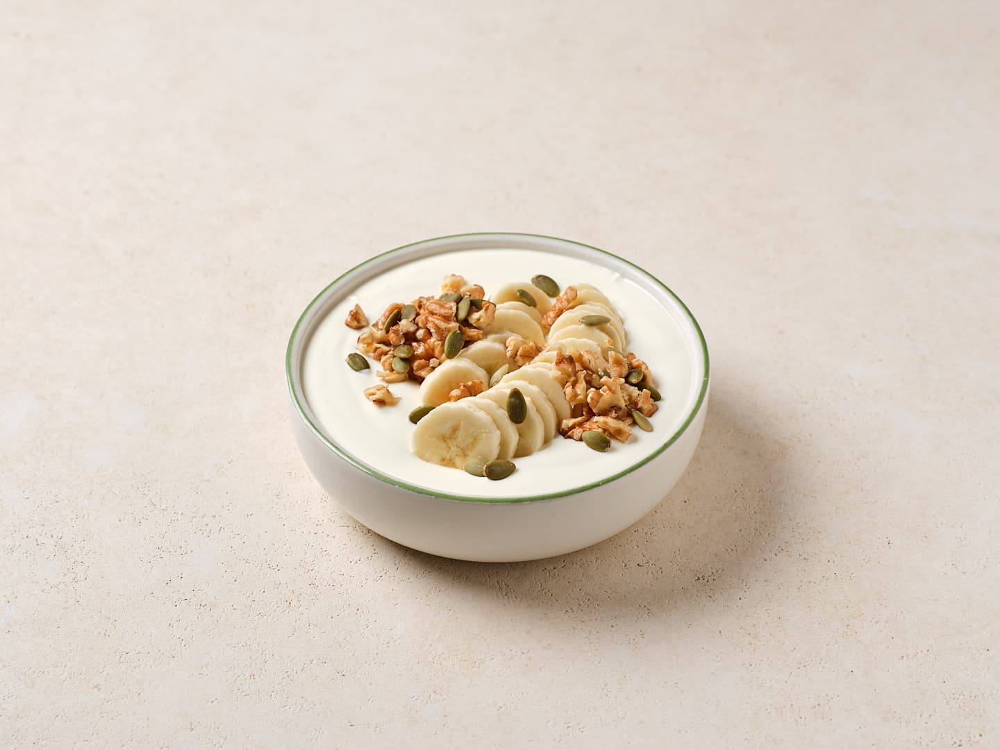 Unsweetened Yogurt Bowl with Banana, Pumpkin Seeds, & Walnuts
