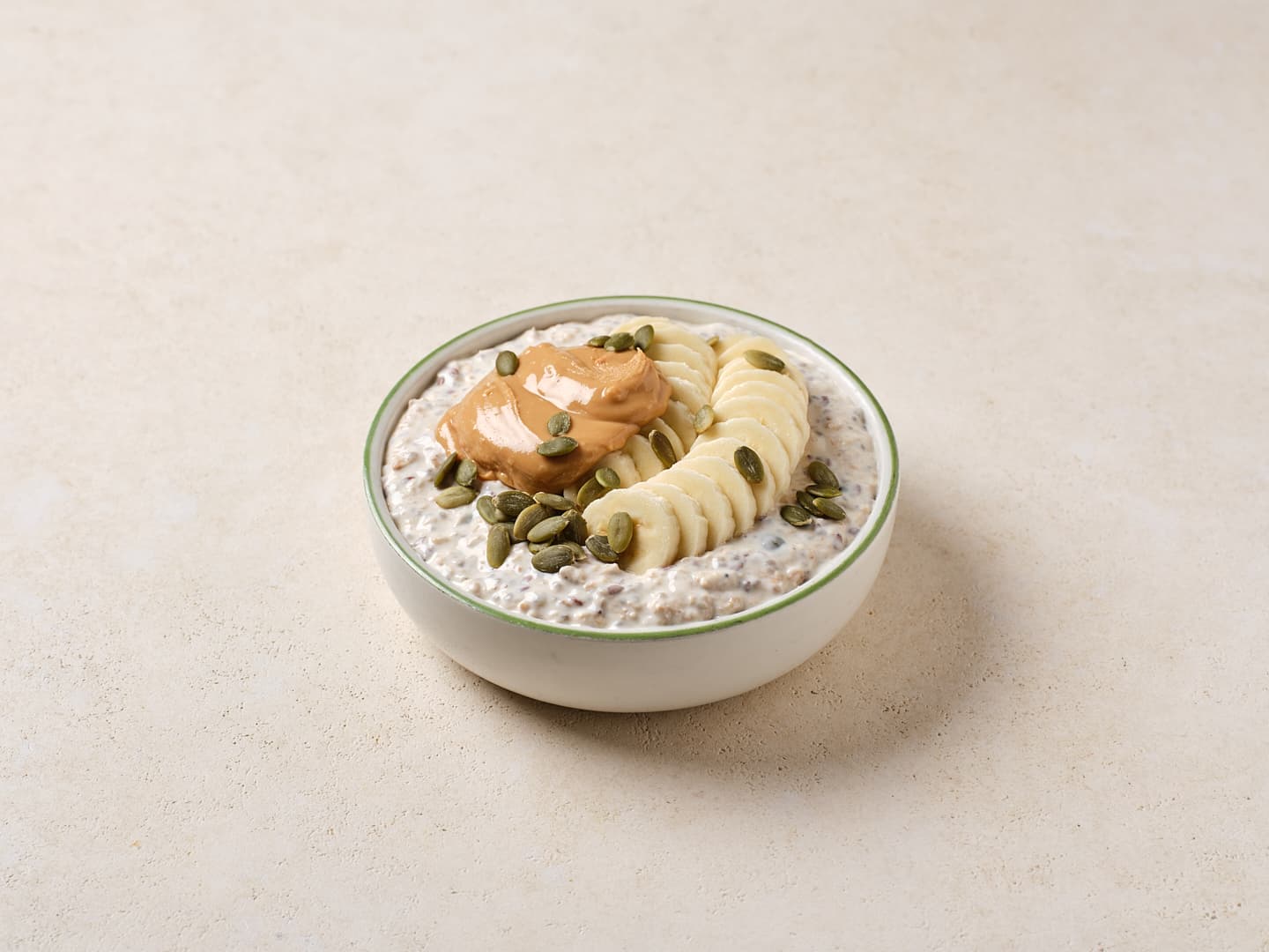 Overnight Oats with Banana, Peanut Butter, & Pumpkin Seeds